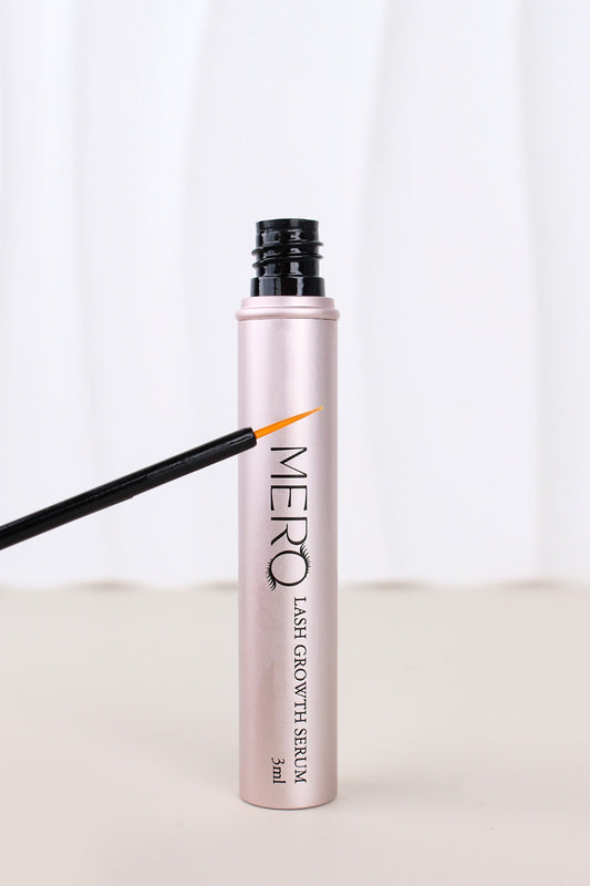 MERO Lash Growth Serum in a sleek pink tube with applicator, designed for nourishing and enhancing lashes.